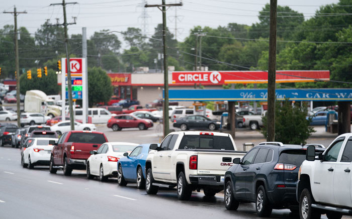 Motorists wait in line to refuel at a Circle K gas station on 12 May 2021 in Fayetteville, North Carolina. Most stations in the area along I-95 are without fuel following the Colonial Pipeline hack. The 5,500 mile long pipeline delivers a large percentage of fuel on the East Coast from Texas up to New York. Picture: SEAN RAYFORD/AFP
