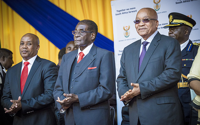 South African President Jacob Zuma and Zimbabwean President Robert Mugabe made their way through the University of Fort Hare sports complex and onto stage to the singing and cheering of the audience. Picture: Thomas Holder/EWN.