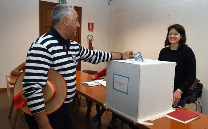 A gondoliere casts his ballot at a polling station during an autonomy referendum in Venice, on 22 October 2017. Picture: AFP