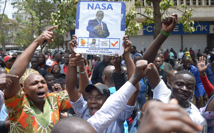 Supporters of Kenya's opposition National Super Alliance celebrate outside the Supreme Court in Nairobi on 1 September 2017 after Kenya's Supreme Court ordered a new presidential election. Picture: AFP.
