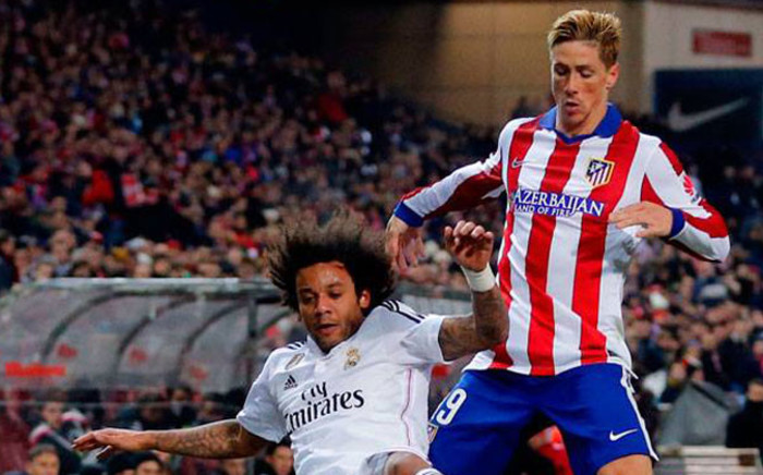 Atletico Madrid's Fernando Torres and Real Madrid's Marcelo fighting for the ball during their first leg in the Kings Cup last 16 tie on 7 January 2015. Picture: Real Madrid official Facebook page.