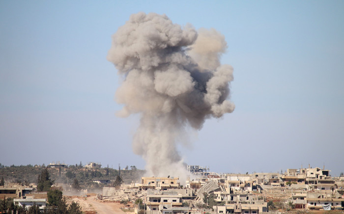 FILE: Smoke billows following reported air strikes by Syrian government forces in a rebel-held area of Daraa in southern Syria, on 17 February 2016. Picture: AFP.