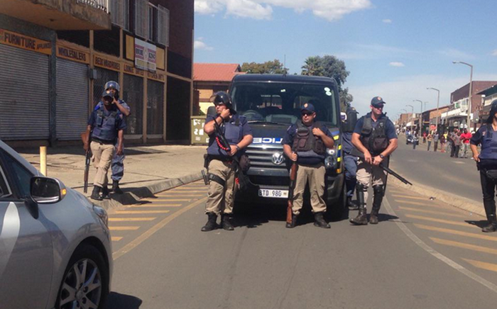 Police getting ready to move into a hostel in Johannesburg. Picture: Mia Lindeque/EWN.