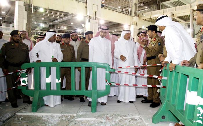 Saudi governor of Mecca region Khaled al-Faisal (center R) inspects the site of a crane that crashed onto the Grand Mosque of Saudi Arabia’s holy Muslim city of Mecca on 12 September, 2015. Picture: AFP.