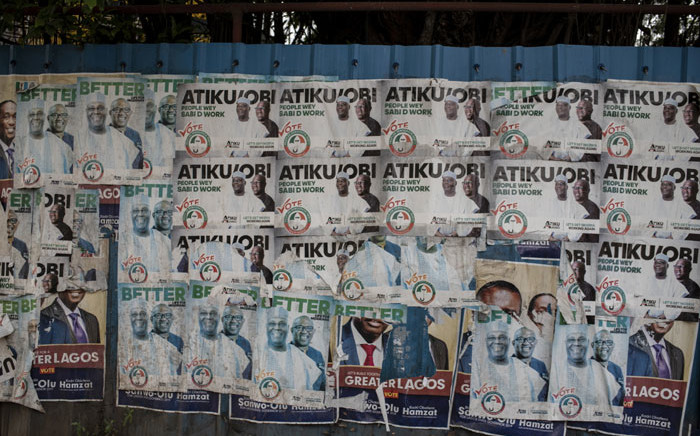 A picture taken on 11 February 2019 shows a wall covered with posters of presidential candidate Atiku Abubakar of the Peoples Democratic Party (PDP,) the official opposition party, in Lagos. Picture: AFP