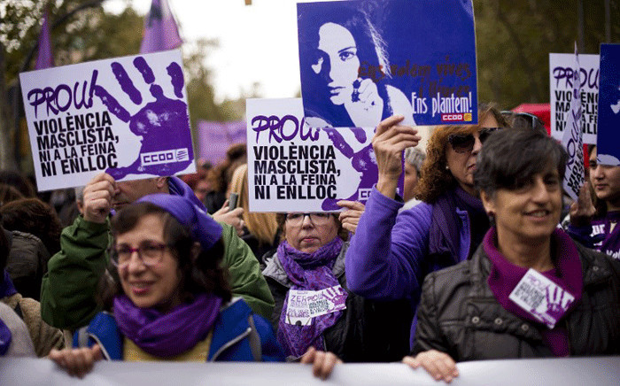 Women hold placards reading "Enough of sexist violence, neither at work nor anywhere" during a demonstration under the slogan "Together we buried the patriarchal order" to mark the International Day for the Elimination of Violence against Women in Barcelona on November 25, 2018. Picture: AFP.