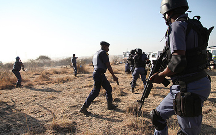 Police open fire at protesting workers at the Lonmin mine in Marikana in the North West on 16 August 2012. Picture: EWN.
