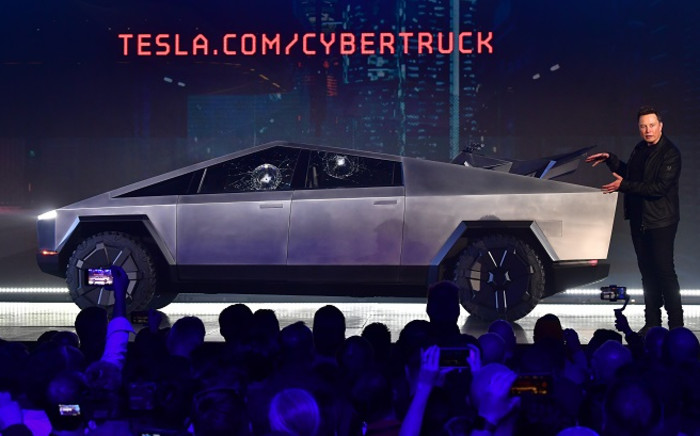 Tesla co-founder and CEO Elon Musk gestures while wrapping up his presentation of the newly unveiled all-electric battery-powered Tesla Cybertruck at Tesla Design Center in Hawthorne, California on 21 November 2019. Picture: AFP