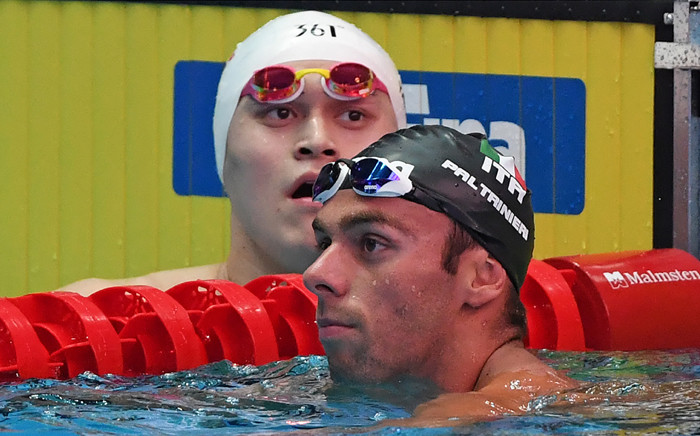 China's Sun Yang (L) and Italy's Gregorio Paltrinieri react after a heat for the men's 800m freestyle event during the swimming competition at the 2019 World Championships at Nambu University Municipal Aquatics Center in Gwangju, South Korea, on 23 July 2019. Picture: AFP.
