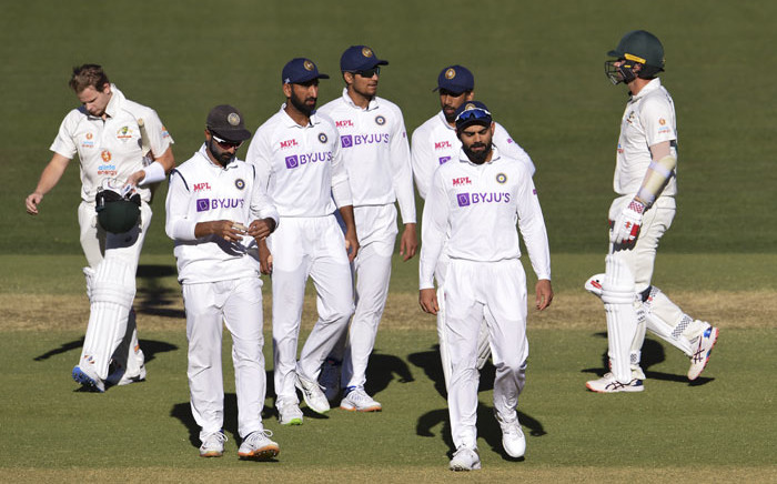 India's captain Virat Kohli (2/R) leads his players off the field after their loss to Australia on the third day of the first cricket Test match between Australia and India played in Adelaide on 19 December 2020. Picture: AFP