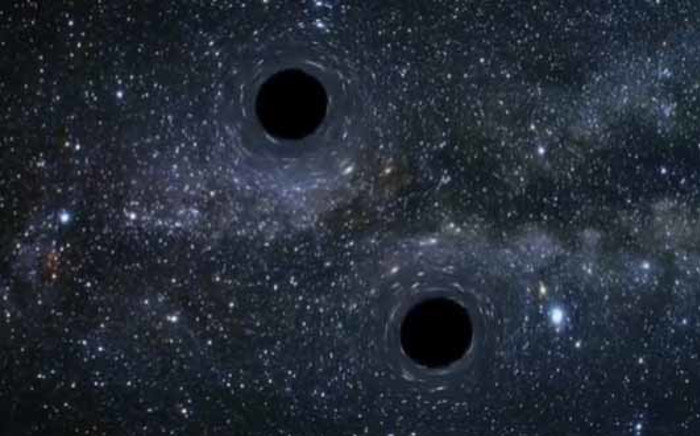 A screengrab of colliding black holes.