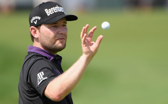 Branden Grace catches a ball on the fourth green during the final round of the US Open at Oakmont Country Club on 19 June 2016 in Oakmont, Pennsylvania. Picture: Ross Kinnaird/Getty Images/AFP.