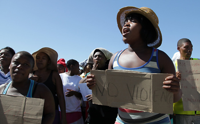 Delft community members marched on 14 February 2014 to raise awareness about child safety following another murder in the area. Picture: Aletta Gardner/EWN.