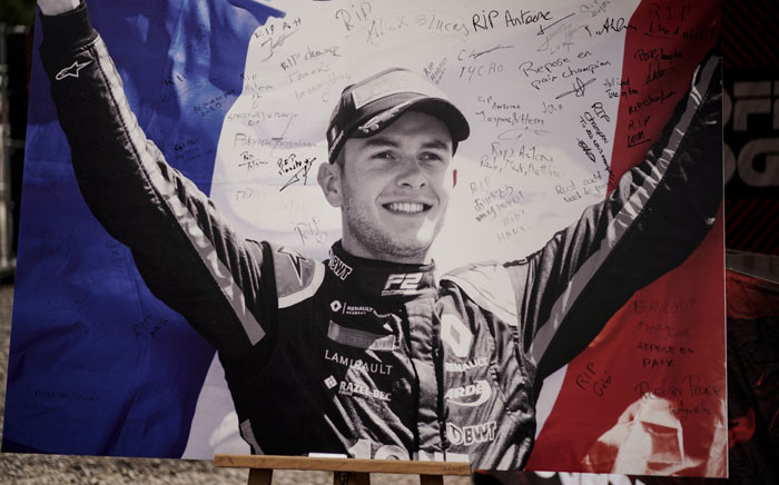 This picture taken on 1 September 2019 shows the portrait of BWT Arden's French driver Anthoine Hubert covered with condolence messages at the entrance of the Spa-Francorchamps circuit in Spa, Belgium. Picture: AFP
