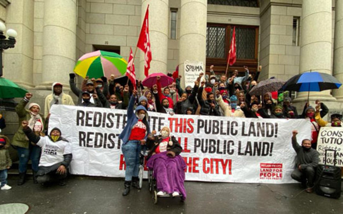 Activists celebrate on 31 August 2020 a Wester Cape High Court ruling setting aside the Wester Cape government's sale of the Tafelberg property in Sea Point to a private buyer. Picture: @NdifunaUkwazi/Twitter