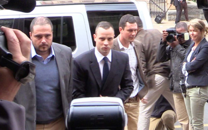 Oscar Pistorius enters the High Court in Pretoria ahead of his murder trial on 6 May 2014. Picture: Christa Eybers/EWN.