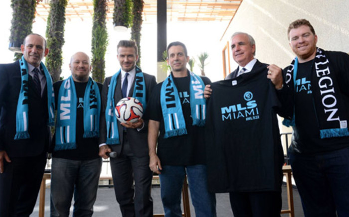 David Beckham poses with his partners after unveiling plans to join the Major League Soccer. Picture: Facebook.