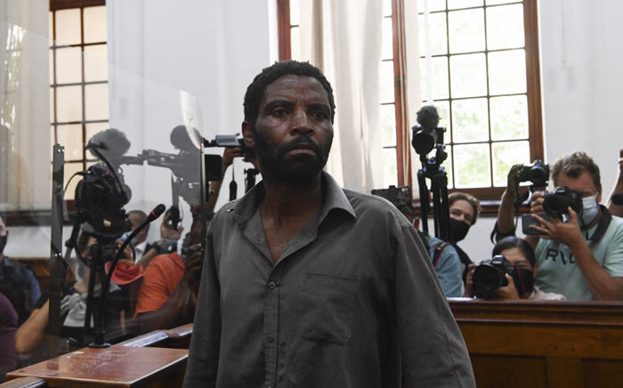Zandile Christmas Mafe, a suspect in connection to a fire at the South African Parliament, appears in the Cape Town Magistrates Court in Cape Town on 4 January 2022. Picture: RODGER BOSCH/AFP