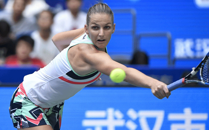 Karolina Pliskova of the Czech Repubic hits a return against Ashleigh Barty of Australia during their women's singles quarter-final match at the WTA Wuhan Open tennis tournament in Wuhan, in China's central Hubei province on 28 September 2017. Picture: AFP.