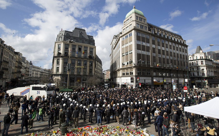 Anti-riot police officers surround protesters who disturbed a tribute to the victims of terror attacks on Place de la Bourse in Brussels on 27 March 2016. Picture: AFP.