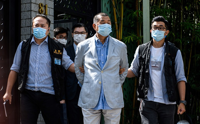 Police lead Hong kong pro-democracy media mogul Jimmy Lai (C), 72, away from his home after he was arrested under the new national security law in Hong kong on 10 August 2020. Picture: AFP
