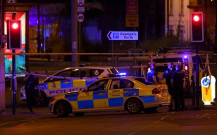 Police deploy at the scene of an explosion in Manchester, England, on 23 May 2017 at an Ariana Grande concert. Picture: AFP.