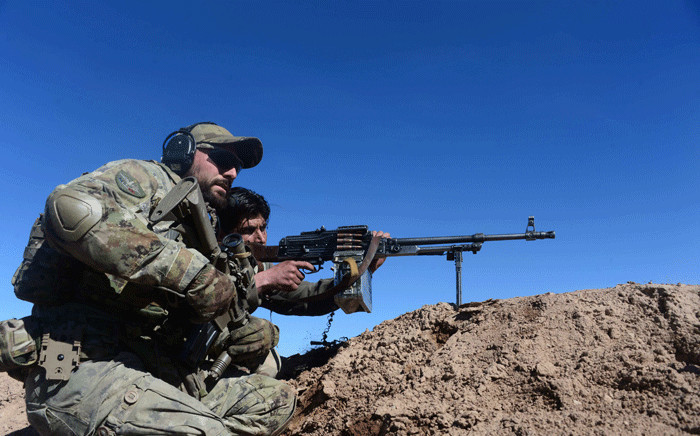 FILE: In this photograph taken on 9 February 2017, an Italian soldier from NATO's Resolute Support Mission trains an Afghan National Army (ANA) soldier at a Military Training centre on the outskirts of Herat. Picture: AFP