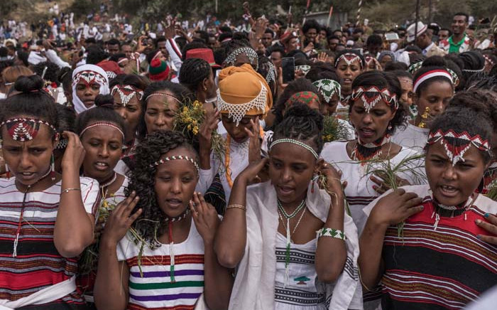 People from community of Oromo from different parts of Ethiopia celebrate Irreecha Afaan Oromo, also called Irreessa, a Thanksgiving holiday of the Oromo People in Ethiopia on September 30, 2018 in Bishoftu, Oromia. YONAS TADESSE / AFP