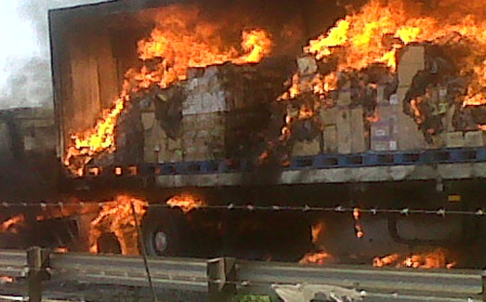 A burning truck in Boksburg that was allegedly attacked by striking truck drivers who are on a wage strike on 4 October, 2012. Picture: Supplied.