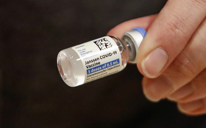 FILE: In this file photo taken on 5 March 2021 registered nurse Florisa N. Lingad holds a Johnson & Johnson Covid-19 vaccine at a vaccination center established at the Hilton Chicago O'Hare Airport Hotel in Chicago, Illinois. Picture: AFP