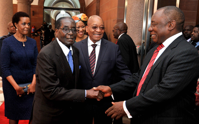 President Jacob Zuma and his deputy Cyril Ramaphosa receive Zimbabwe President Robert Mugabe at the Union Buildings on his state visit on 8 April 2015. Picture: GCIS.