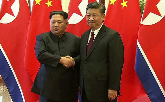 Chinese President Xi Jinping and North Korean leader Kim Jong Un shaking hands during their meeting in Beijing on 27 March 2018. Picture: AFP