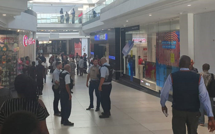 Security personnel secure the area following an attempted robbery at the Dion Wired store at the Cresta Shopping Centre in Johannesburg on 8 October 2019. Picture: Intelligence Bureau SA