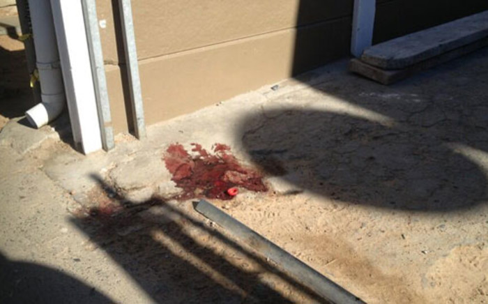 A pool of dry blood marks the scene where one of five men was gunned down at a house in Rocklands, Mitchells Plain on 19 March 2013. Picture: Regan Thaw/EWN