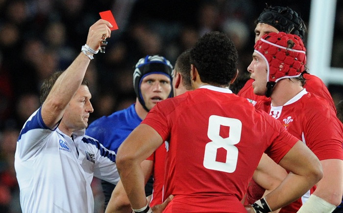 FILE: Referee Alain Rolland of Ireland gives a red card to Wales' flanker Sam Warburton (not pictured) during the 2011 Rugby World Cup semi-final match Wales vs France at the Eden Park in Auckland on 15 October 2011. Picture: AFP