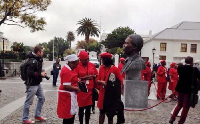 Red-clad members of the Economic Freedom Fighters (EFF) arrive at Parliament dressed as workmen and domestic workers on 21 May 2014. Picture: EWN.
