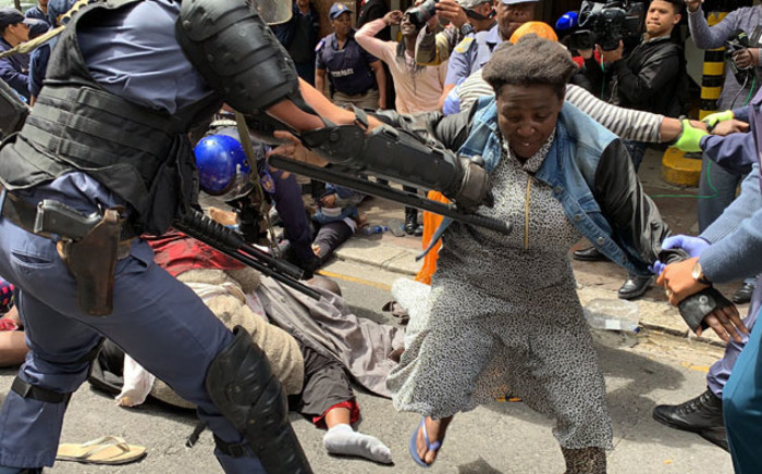 Police remove foreign nationals on 30 October 2019 who were camping outside the UN Refugee Agency asking for help to leave South Africa. Picture: Kaylynn Palm/EWN