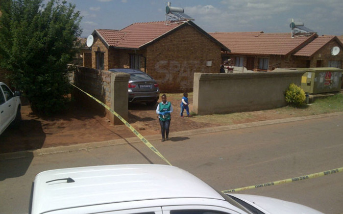 FILE: Crime scene investigators outside the Vosloorus house where Bafana Bafana captain Senzo Meyiwa was killed. Picture: Sapa.