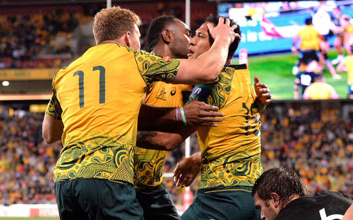 Australian players celebrate a try against the All Blacks in their Bledisloe Cup match on 21 October 2017 at the Suncorp Stadium in Brisbane. Picture: @AllBlacks/Twitter