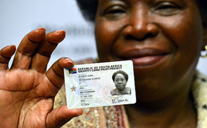 Home Affairs Minister Nkosazana Dlamini Zuma shows her new ID smart card during a media briefing in Cape Town 25 April, 2012. Picture: Aletta Gardner/EWN