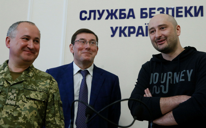 Russian journalist Arkady Babchenko (right), who was reported murdered in the Ukrainian capital on 29 May, Ukrainian Prosecutor General Yuriy Lutsenko (centre) and head of the state security service (SBU) Vasily Gritsak attend a news briefing in Kiev on 30 May 2018. Picture: Reuters
