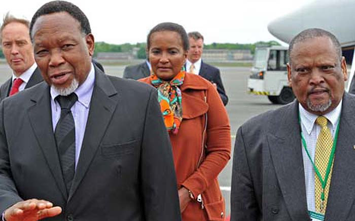 "Deputy President Kgalema Motlanthe (L) is pictured with Makhenkesi Stofile (R) at Tegel Airport, Berlin, Germany in 2012. Picture: Elmond Jiyane/GCIS.