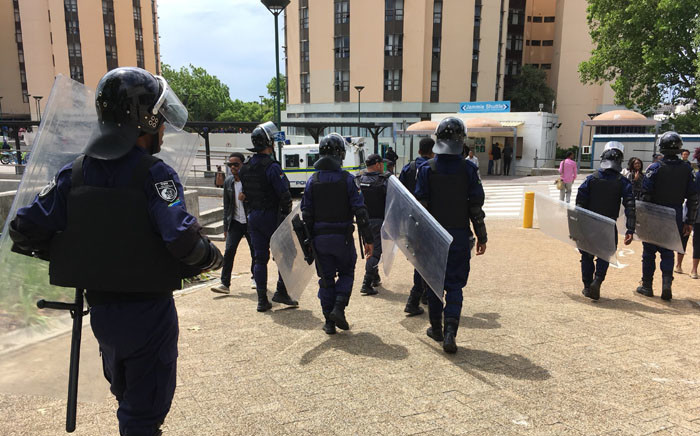 SA Police Service officers are seen among students at the University of Cape Town. Picture: @varsitynews/Twitter.