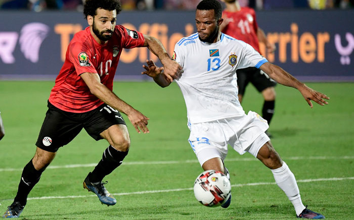 Egypt's Mohamed Salah (L) fights for the ball with DR Congo's Elia Meschak during the 2019 Africa Cup of Nations football match between Egypt and DR Congo at the Cairo International Stadium on June 26, 2019. Picture: AFP