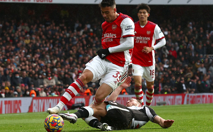 Arsenal's Brazilian striker Gabriel Martinelli (L) is tackled by Newcastle United's Scottish midfielder Ryan Fraser during the English Premier League football match between Arsenal and Newcastle United on 27 November 2021. Picture: AFP
