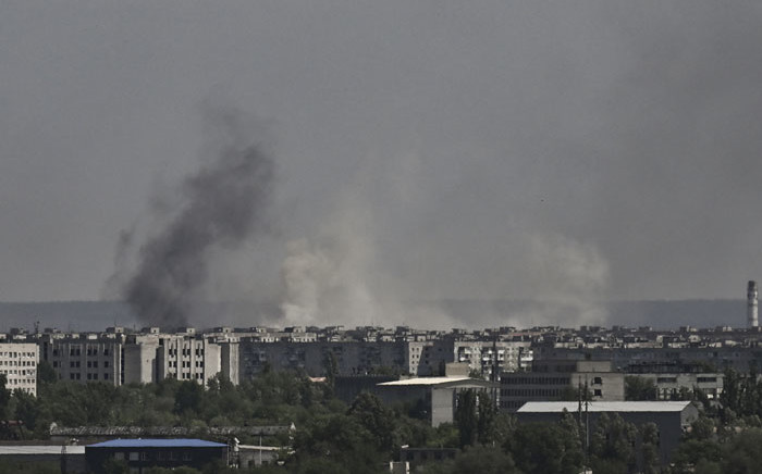 Smoke and dirt rise from the city of Severodonetsk, during shelling in the eastern Ukrainian region of Donbas, on 26 May 2022, amid Russia's military invasion launched on Ukraine. Picture: ARIS MESSINIS/AFP