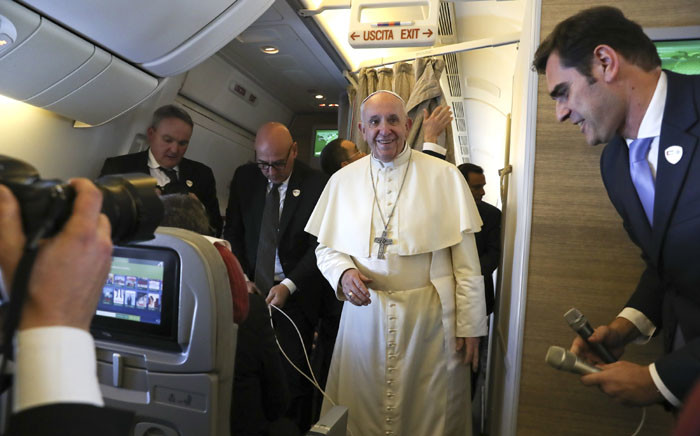 Pope Francis arrives to speak to reporters aboard a plane on the way to Abu Dhabi on 3 February 2019. Pope Francis heads to the UAE on 3 February for the first-ever papal visit to the Arabian Peninsula, birthplace of Islam, where he will hold an open-air mass for tens of thousands of Catholics. Picture: AFP
