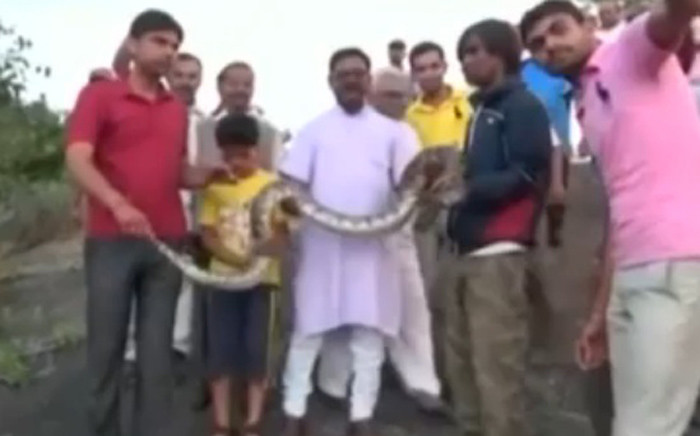 A screengrab of a man trying to take a selfie with the snake in northwestern Indian state of Rajasthan.