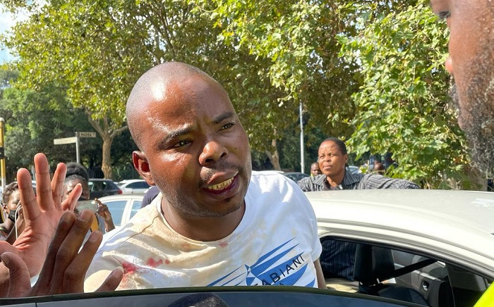 A police officer who had just knocked off was attacked allegedly by protesting e-hailing drivers in Pretoria on 22 March 2022. Picture: Abigail Javier/EWN