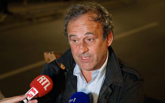 Ex-Uefa chief Michel Platini talks to the media in the early hours of 19 June 2019 before leaving the Central Office for Combating Corruption and Financial and Tax Crimes in Nanterre, west of Paris, after being questioned in connection with a criminal investigation into the award of the 2022 World Cup to Qatar. Picture: AFP.